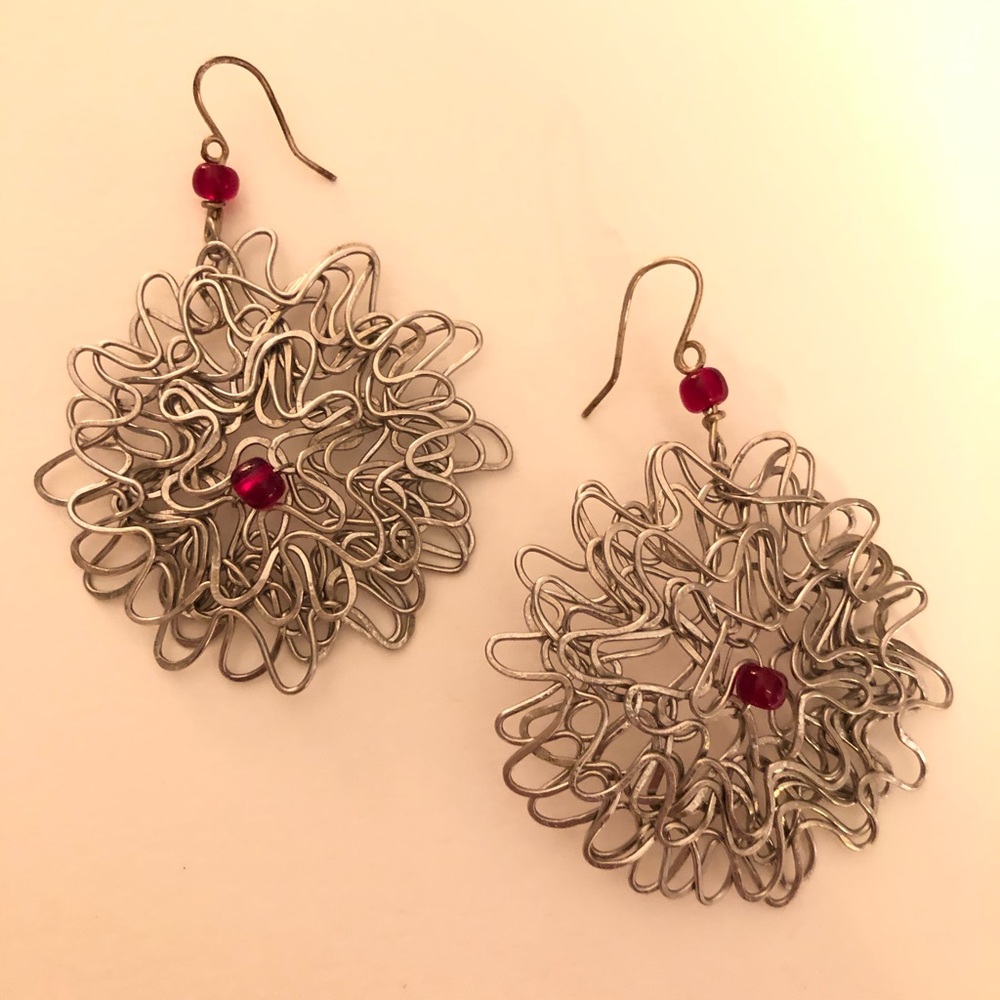 Silver earrings with red stone.
